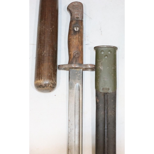 809 - A WWI bayonet with leather and metal sheath, stamped 