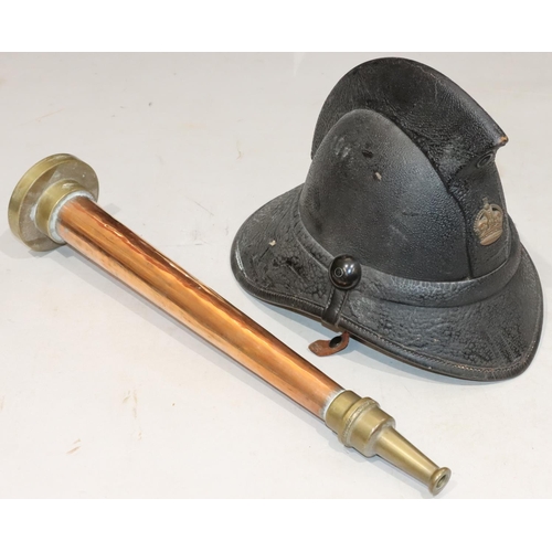 810 - An early leather Fireman's helmet, 23cm high and a Fireman's copper and brass nozzle, 48cm long (2)