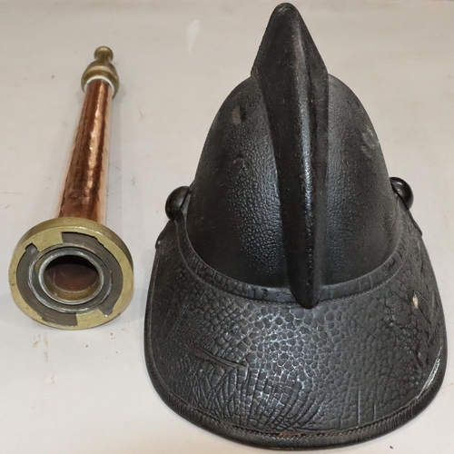 810 - An early leather Fireman's helmet, 23cm high and a Fireman's copper and brass nozzle, 48cm long (2)