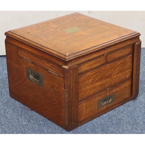 812 - A square oak canteen case with hinged lid enclosing 2 further hinged lids and 1 long drawer below (n... 