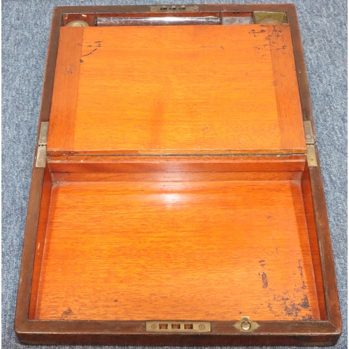 814 - A 19th Century rosewood rectangular shaped writing box with brass mounts and corners, hinged lid enc... 