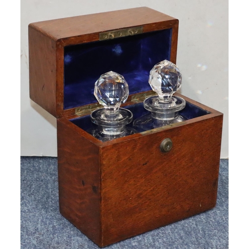 815 - A 19th Century oak rectangular shaped box with hinged lid enclosing 2 square decanters with stoppers... 