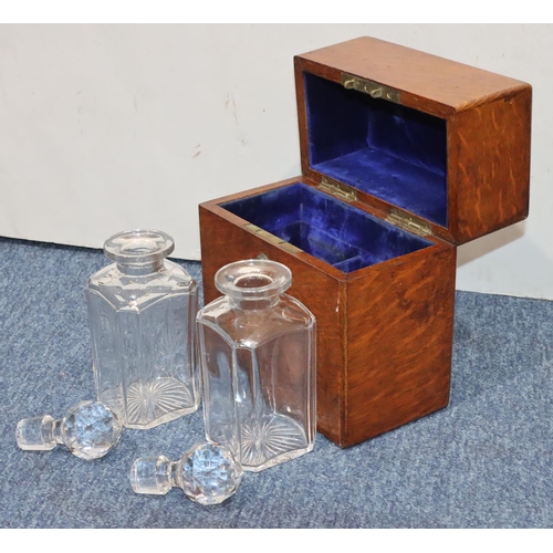 815 - A 19th Century oak rectangular shaped box with hinged lid enclosing 2 square decanters with stoppers... 