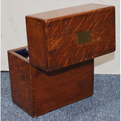 815 - A 19th Century oak rectangular shaped box with hinged lid enclosing 2 square decanters with stoppers... 