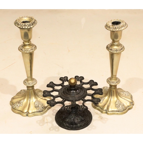 843 - A cast iron revolving tabletop stamp stand on round sweeping base, 16cm diameter, 13cm high and a pa... 