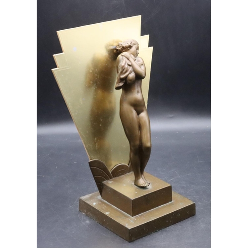 845 - An Art Deco bronze table lamp in the form of a standing female nude standing upon a square plinth (m... 