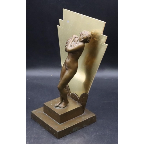 845 - An Art Deco bronze table lamp in the form of a standing female nude standing upon a square plinth (m... 