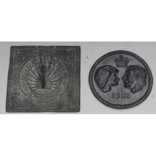 849 - A square lead sun dial with raised figure decoration, 21.5cm wide and a modern heavy leaf circular w... 