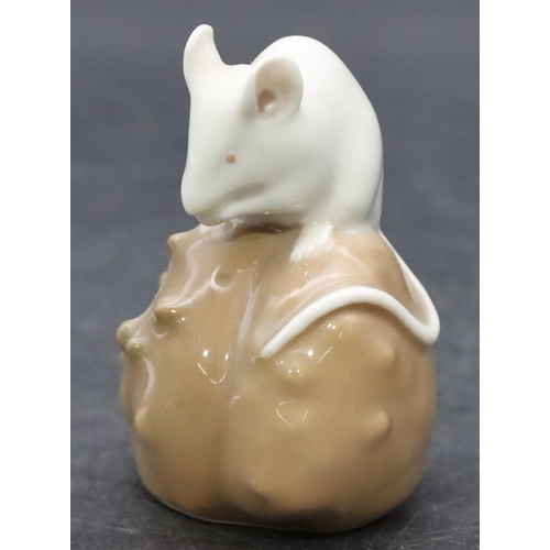 85 - A Royal Copenhagen small figure of a mouse seated upon a nut, number 511, 6.8cm high