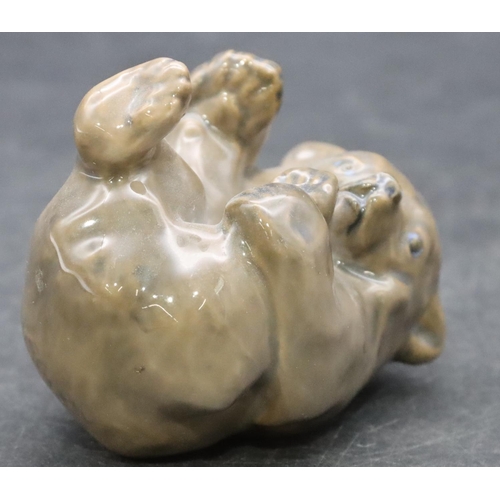 87 - A Royal Copenhagen figure of a bear cub on his back, number 1124, 6cm high