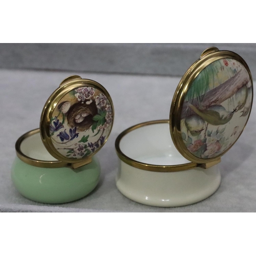 876 - 2 Leslie Creasey enamelled round bulbous shaped pill boxes depicting bird and bird's nest (both boxe... 