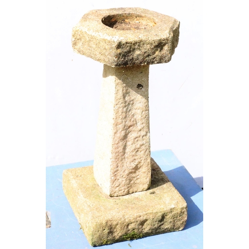 878 - A small concrete hexagonal bird bath on tapering base and square plinth, 62cm high, 31.5cm wide