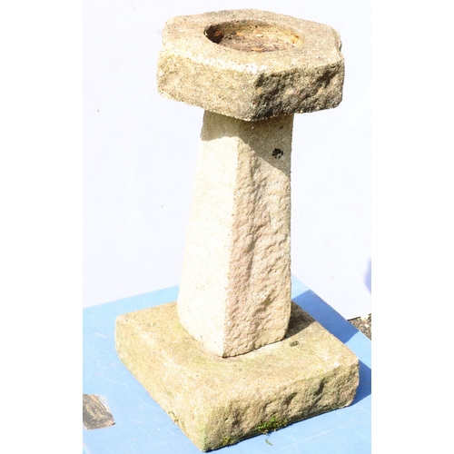 878 - A small concrete hexagonal bird bath on tapering base and square plinth, 62cm high, 31.5cm wide