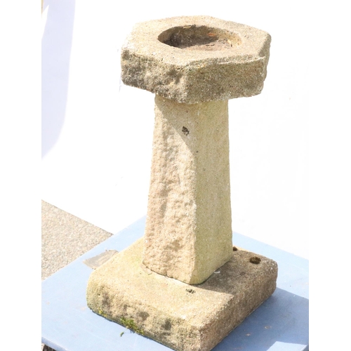 878 - A small concrete hexagonal bird bath on tapering base and square plinth, 62cm high, 31.5cm wide