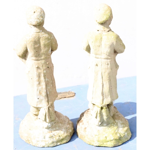 880 - A pair of concrete small garden figures of standing boys, 44cm high