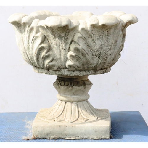 882 - A concrete round bulbous garden jardinière with scallop shaped rim and raised leaf decoration on spl... 