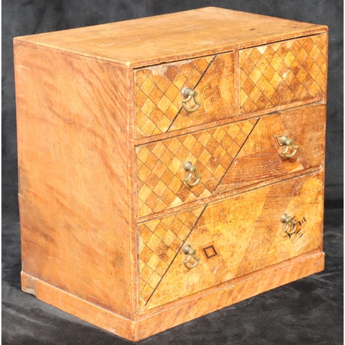 891 - An Oriental style table top small chest with parquetry decoration, 2 short and 2 long graduated draw... 