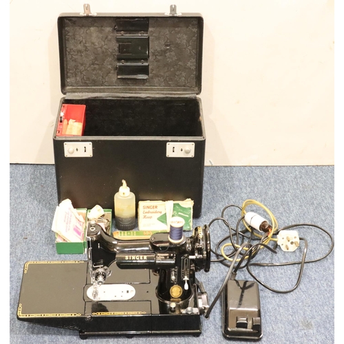 899 - A Singer 222K electric sewing machine (cased) with foot pedal and accessories