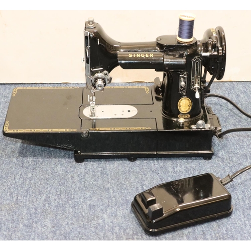 899 - A Singer 222K electric sewing machine (cased) with foot pedal and accessories