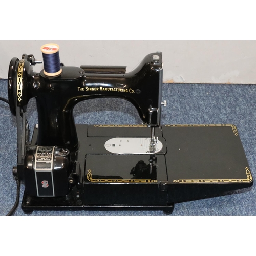 899 - A Singer 222K electric sewing machine (cased) with foot pedal and accessories