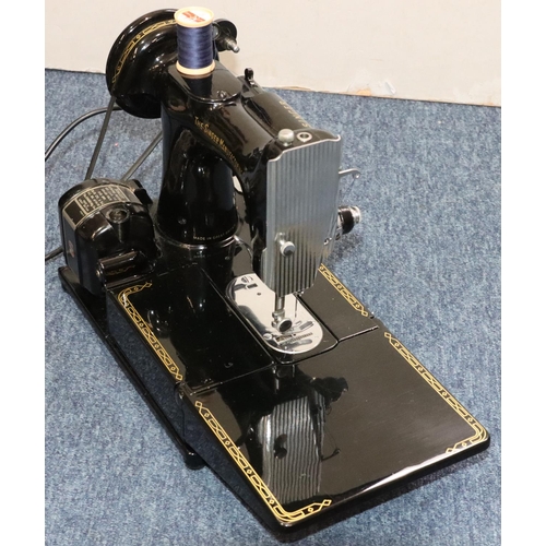 899 - A Singer 222K electric sewing machine (cased) with foot pedal and accessories