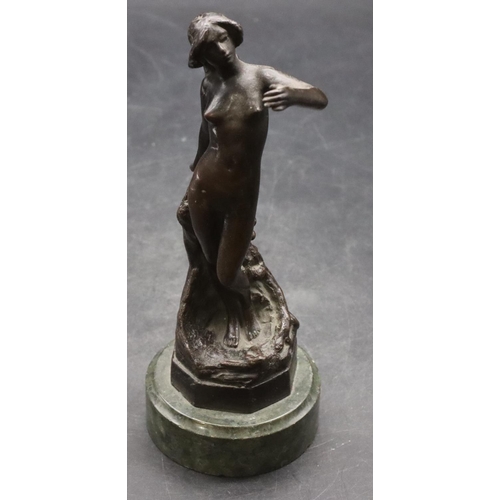 902 - A bronze figure of a female standing nude mounted on green base, 19cm high