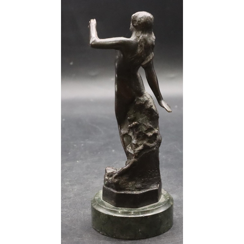 902 - A bronze figure of a female standing nude mounted on green base, 19cm high