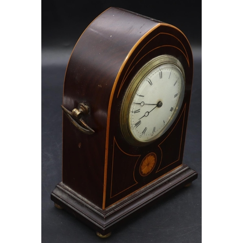 906 - An Edwardian mahogany time piece with inlaid shell motif and stringing, 2 brass carrying handles on ... 