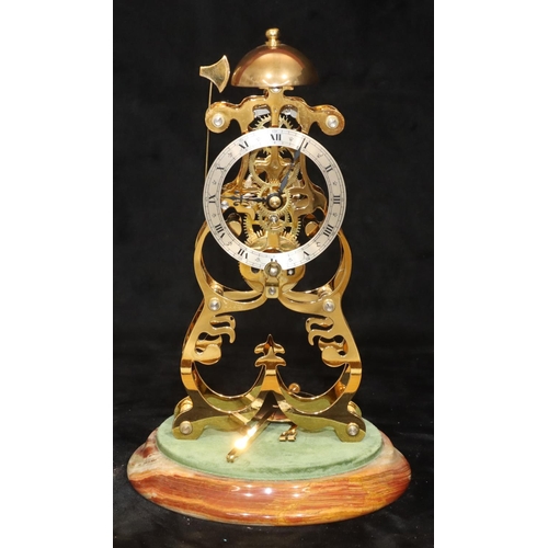 910 - A modern gilt metal striking skeleton clock on round onyx base with dome (Clip to top of pendulum mi... 