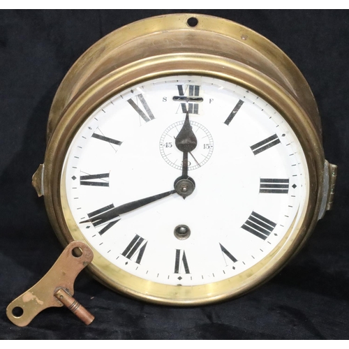 915 - A brass circular hanging wall clock with white enamel dial, seconds dial and Roman numerals, 21cm wi... 