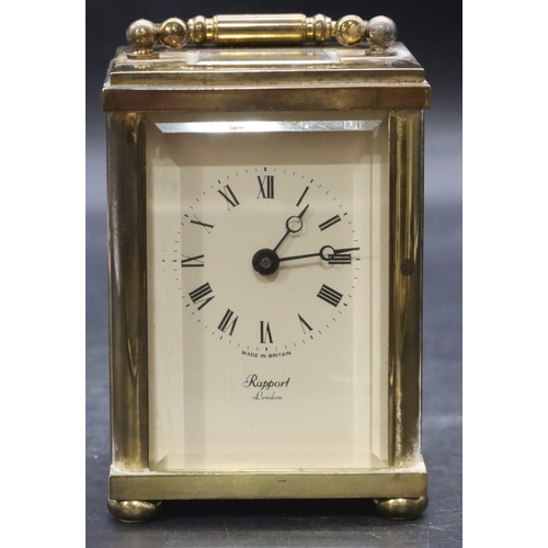 916 - Rapport, London, brass carriage clock with white enamel dial, Roman numerals, swing overhead handle ... 