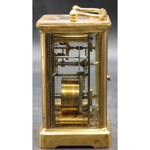 921 - R & Co., Paris, brass carriage clock with white enamel dial and Roman numerals, brass swing overhead... 