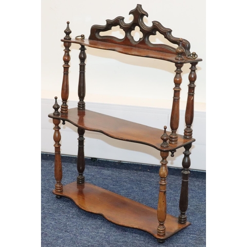 929 - A Victorian walnut 3-tier hanging set of scallop shaped shelves with turned finials, 41cm wide, 55.5... 