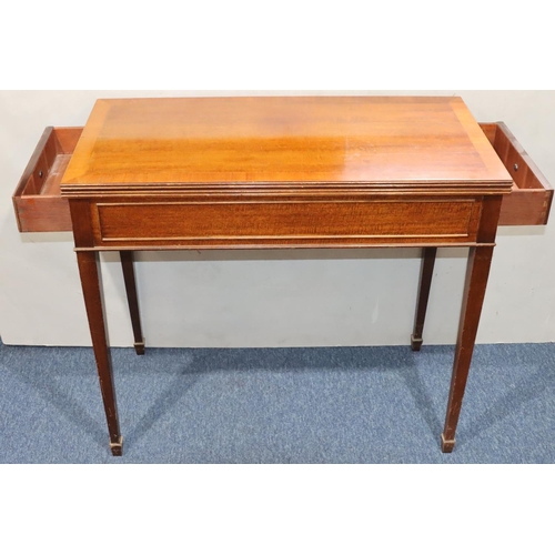 936 - A reproduction mahogany swivel top card table with banded rim, 2 end drawers on square tapering legs... 