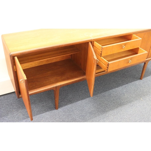 937 - A Younger retro teak large sideboard with 4 centre drawers flanked by 4 panelled doors, 214cm long, ... 