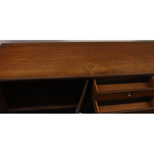 937 - A Younger retro teak large sideboard with 4 centre drawers flanked by 4 panelled doors, 214cm long, ... 