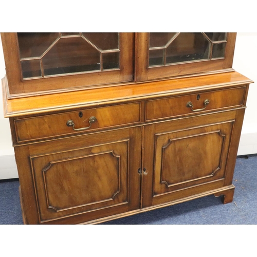 939 - A George III mahogany bookcase with 2 astragal glass doors enclosing leather fronted adjustable shel... 