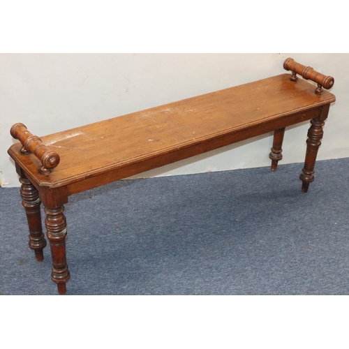 943 - A 19th Century mahogany duet hall stool with carved scroll handles on turned legs, 122cm long, 30cm ... 