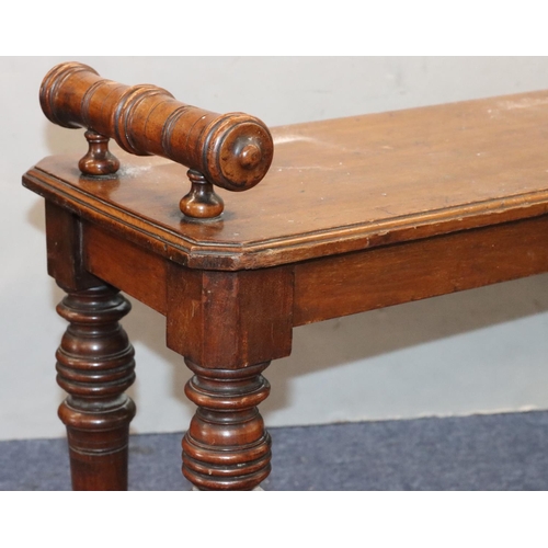 943 - A 19th Century mahogany duet hall stool with carved scroll handles on turned legs, 122cm long, 30cm ... 