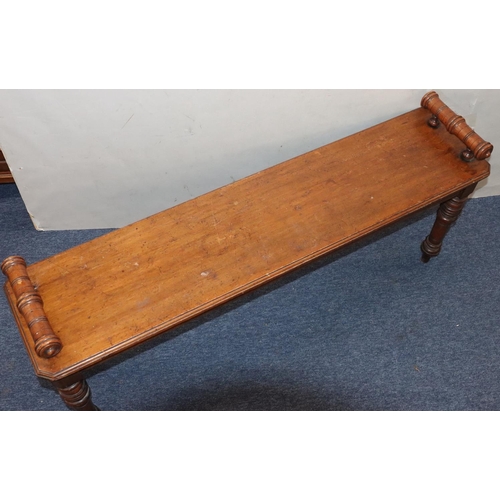 943 - A 19th Century mahogany duet hall stool with carved scroll handles on turned legs, 122cm long, 30cm ... 