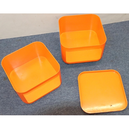 945 - A vintage Anna Castelli, Kartell, orange Componibili, in 2 sections with square removable top, on ca... 