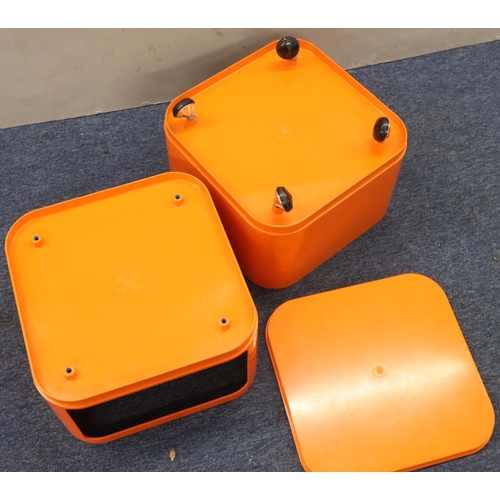 945 - A vintage Anna Castelli, Kartell, orange Componibili, in 2 sections with square removable top, on ca... 