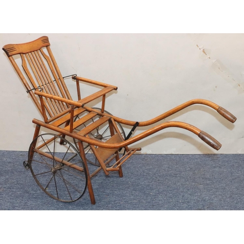 950 - A child's French girl's pram/chair, 86cm long overall