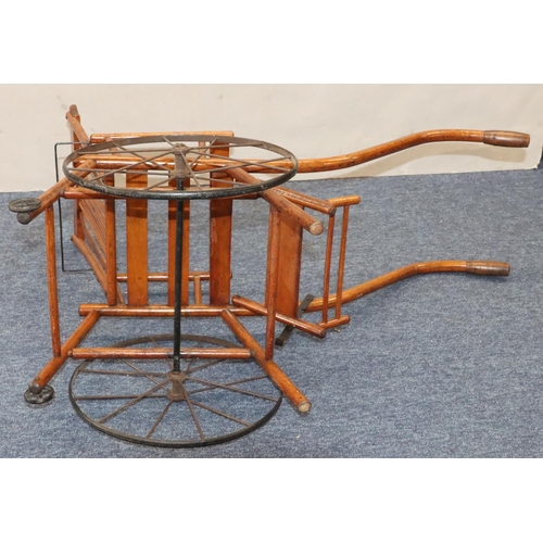 950 - A child's French girl's pram/chair, 86cm long overall