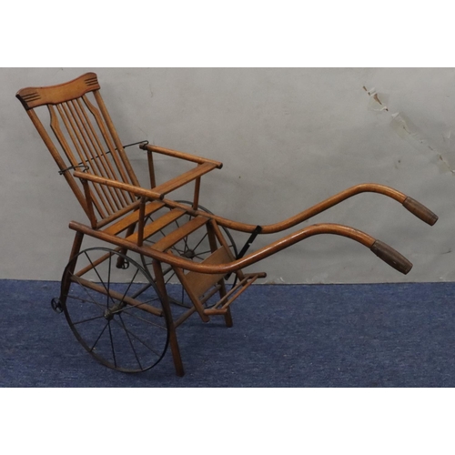 950 - A child's French girl's pram/chair, 86cm long overall