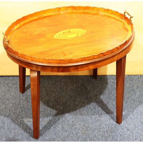 956 - A 19th Century mahogany oval 2-handled tray and stand with inlaid centre shell motif, banded rim and... 