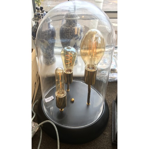 8114 - A modern lamp with 3 reproduction vintage style bulbs and glass dome on circular black metallic base... 