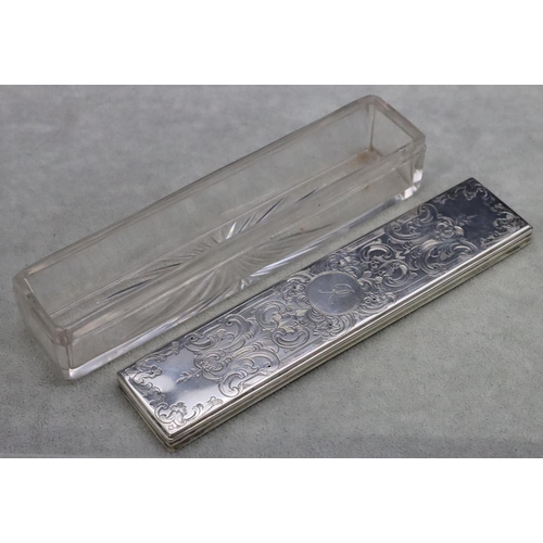 371 - A Victorian rectangular shaped glass dressing table pot with London silver lid and engraved decorati... 