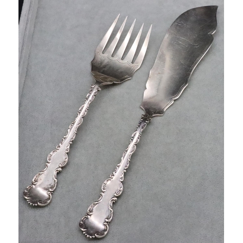 374 - A pair of Sheffield silver fish servers with raised scroll handles, maker's mark HW, 7.1oz