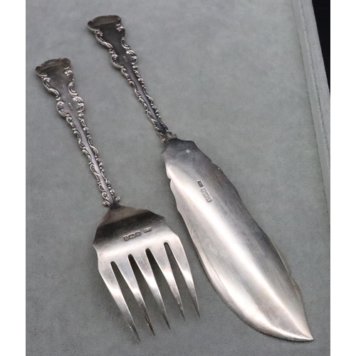 374 - A pair of Sheffield silver fish servers with raised scroll handles, maker's mark HW, 7.1oz